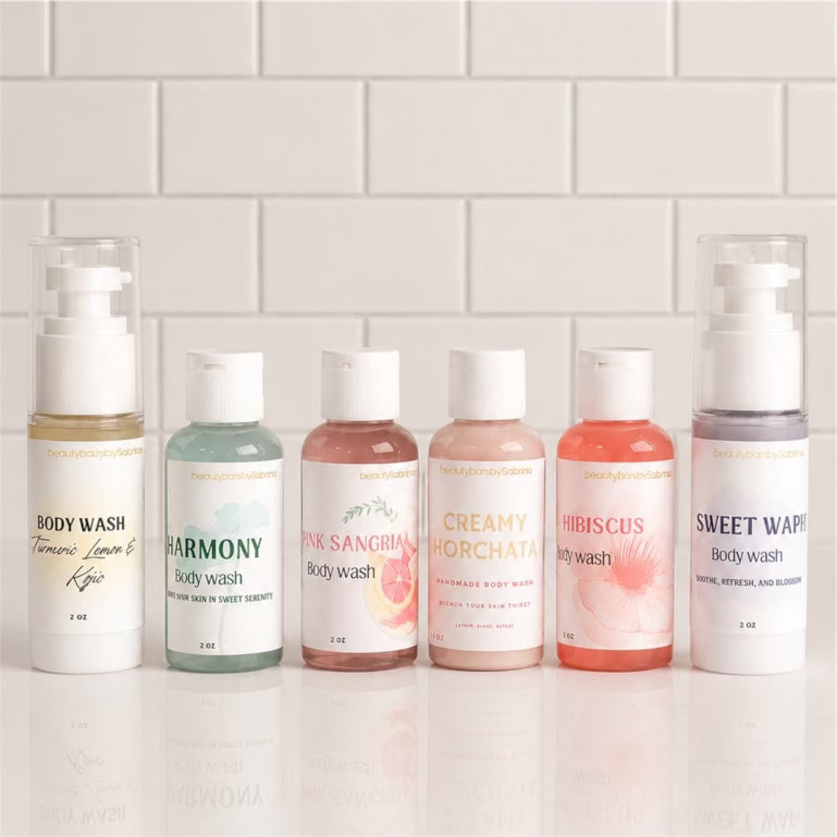 Row of body wash bottles with visible labels on a light tiled wall background
