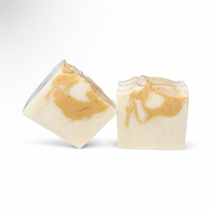 Two bars of soap with a marbled pattern on a white background