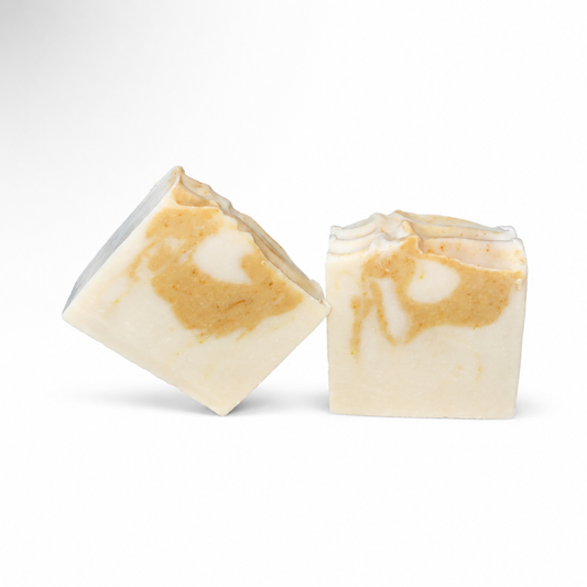 Two bars of soap with a marbled pattern on a white background