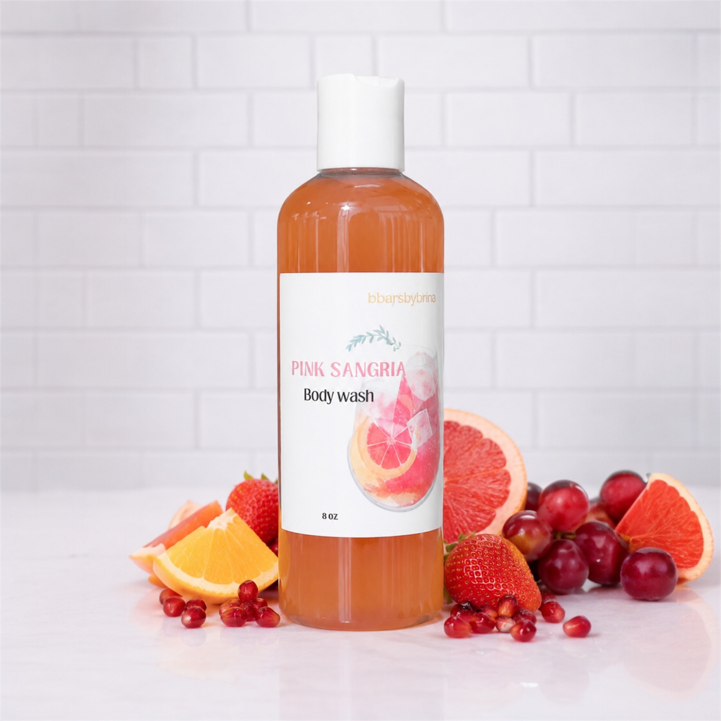 Body wash bottle labeled 'Pink Sangria' with fruit slices on a white background