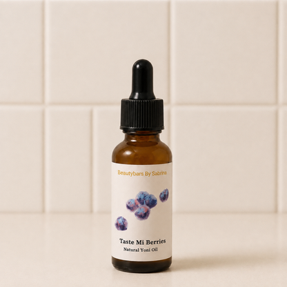 An amber glass dropper bottle of Beautybars By Sabrina 'Taste Mi Berries' natural yeast oil, featuring a white label with blueberry illustrations, set against a beige tiled background.