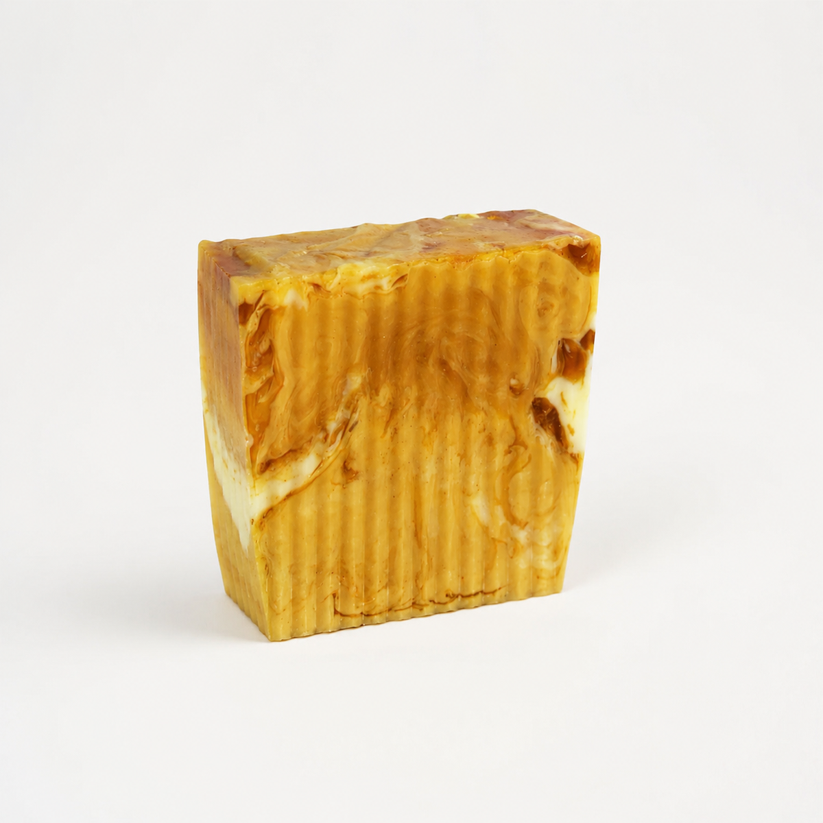 Bar of soap with a marbled pattern on a white background