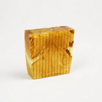 Bar of soap with a marbled pattern on a white background