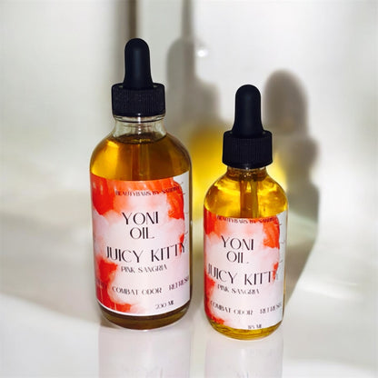 2 bottles of yoni oils and white background 