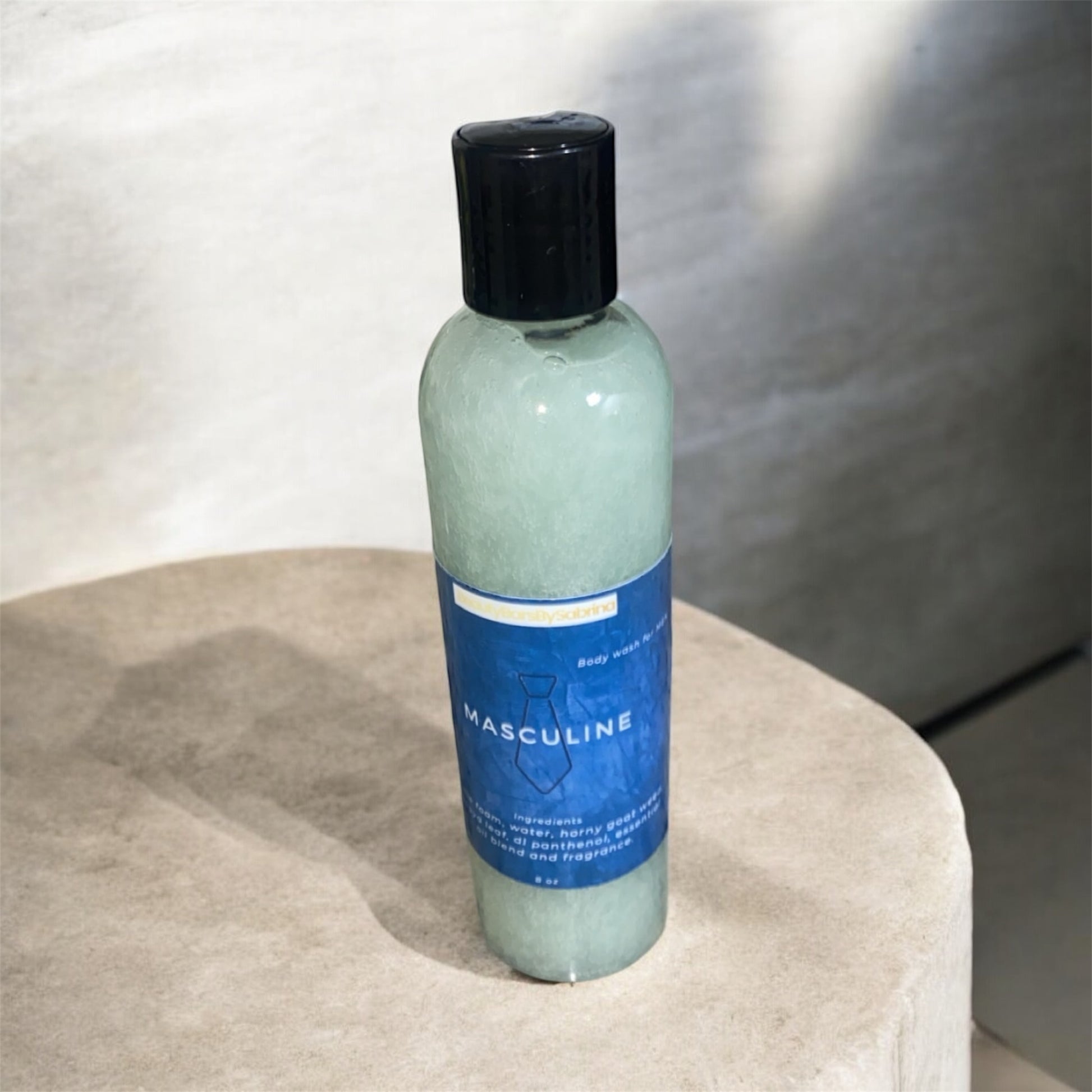 A bottle filled with body wash on stone 