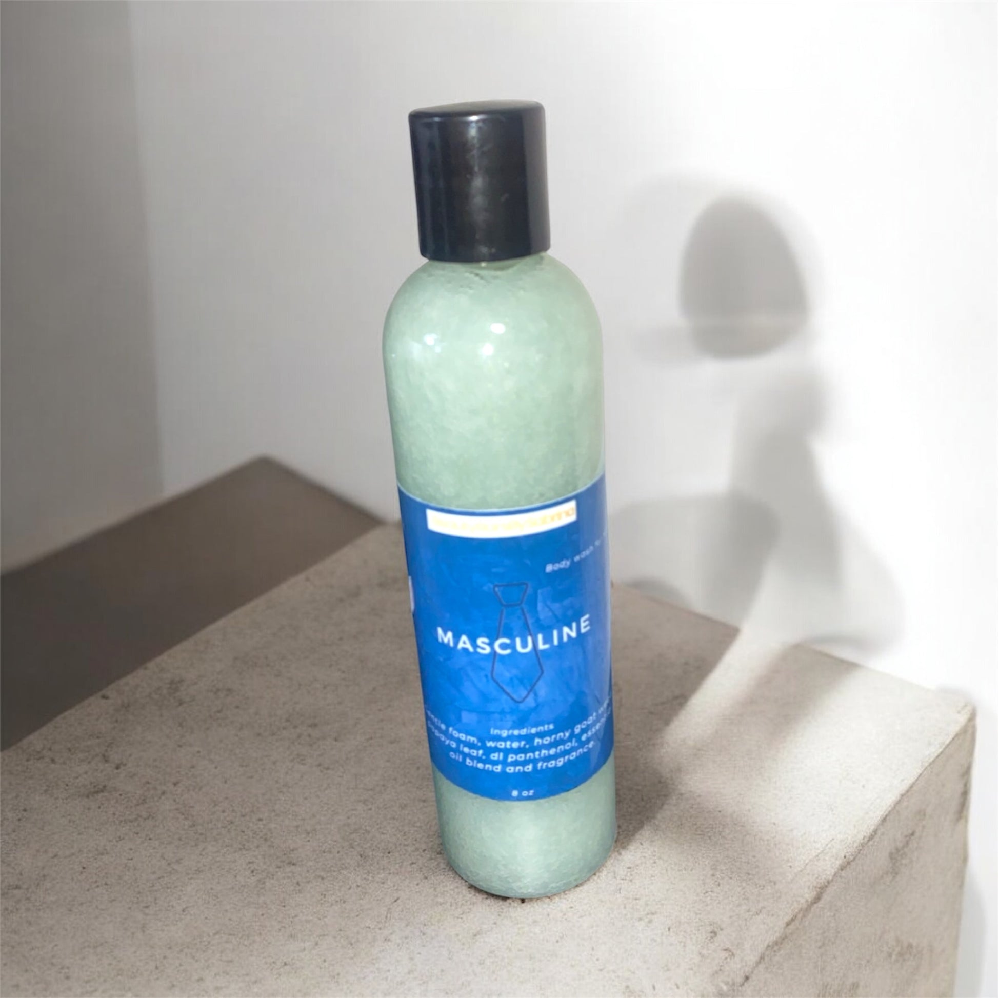 A bottle filled with body wash on stone 