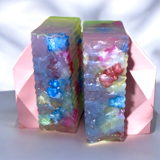 Colorful crystal-like objects with embedded small toys on a white background