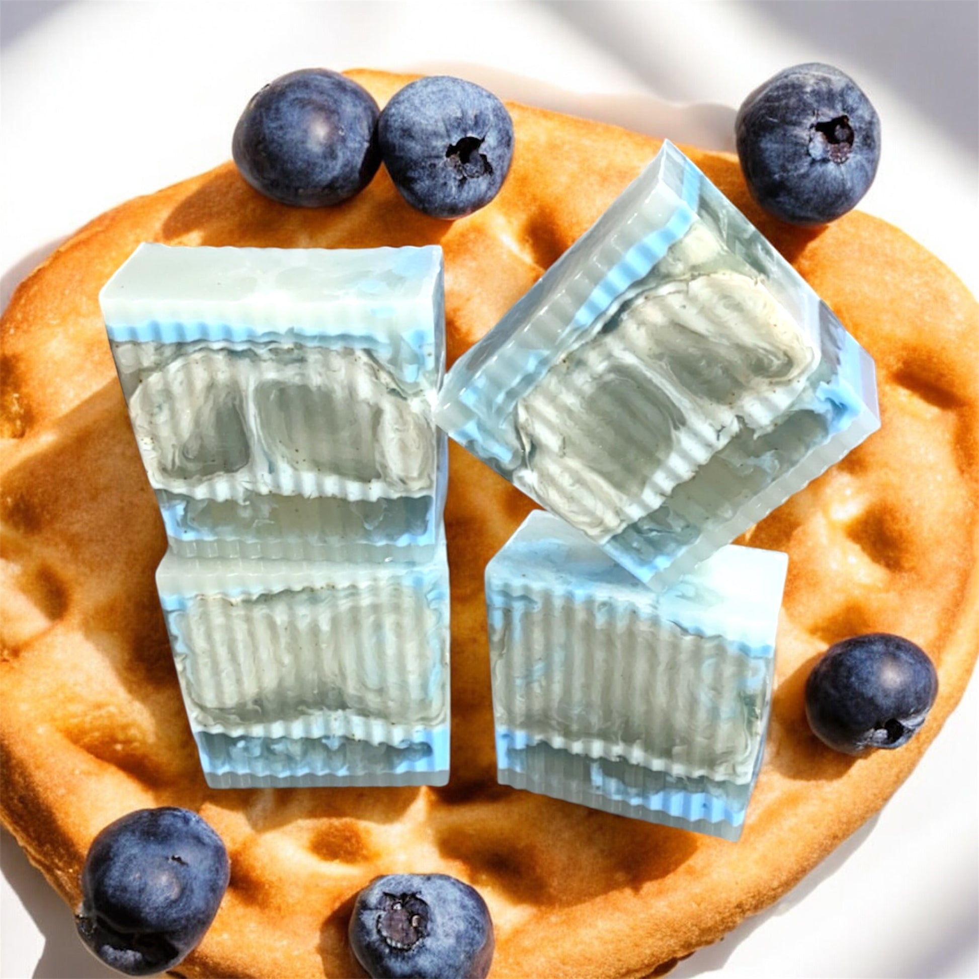 Waffle with blueberries and soap bars on a white background 
