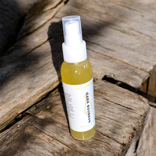 Small spray bottle with a white label on a wooden surface