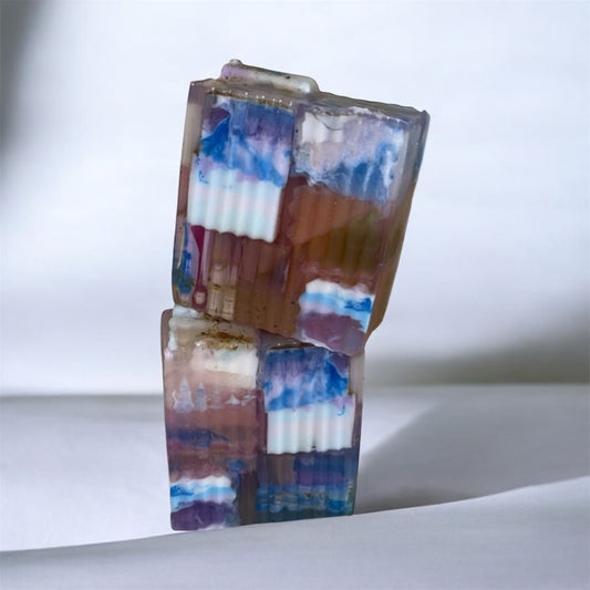 Colorful rectangular soap with a multicolored pattern on a white background
