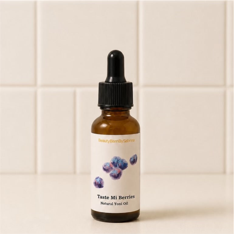 Bottle of 'Taste Mi Berries' natural yoni oil with a dropper on a tiled background
