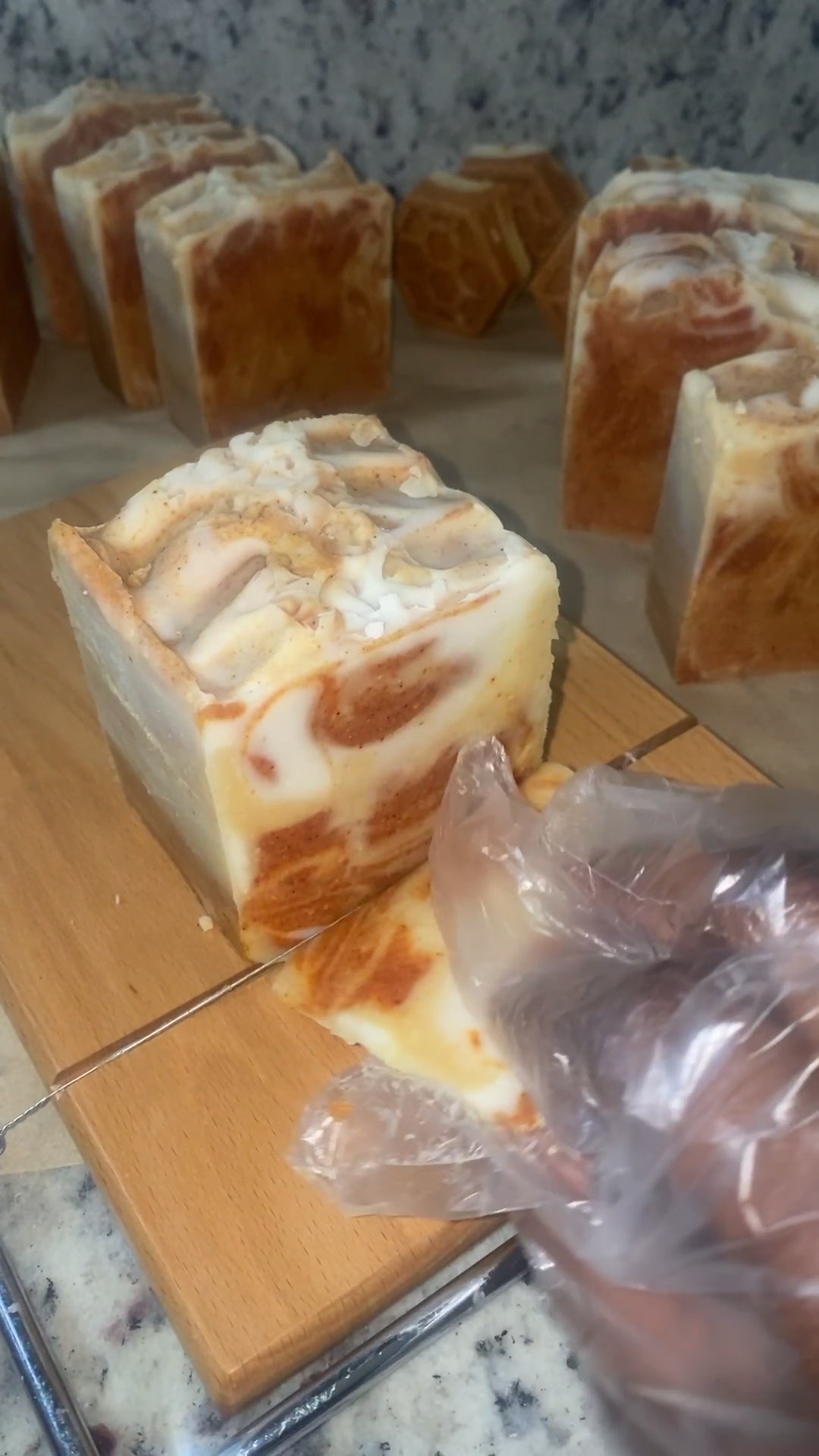 Cutting into turmeric soap with brown and white colors