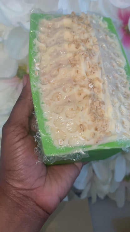 holding soap in a green mold with honey comb texture top